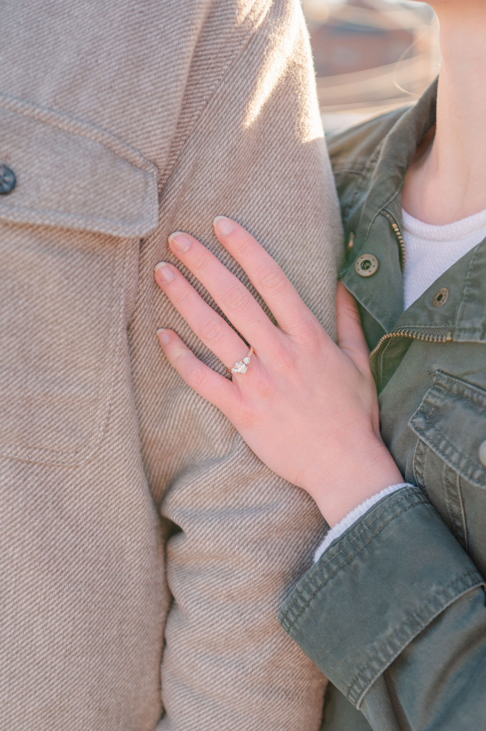 Close-up of engagement ring on bride’s hand.
