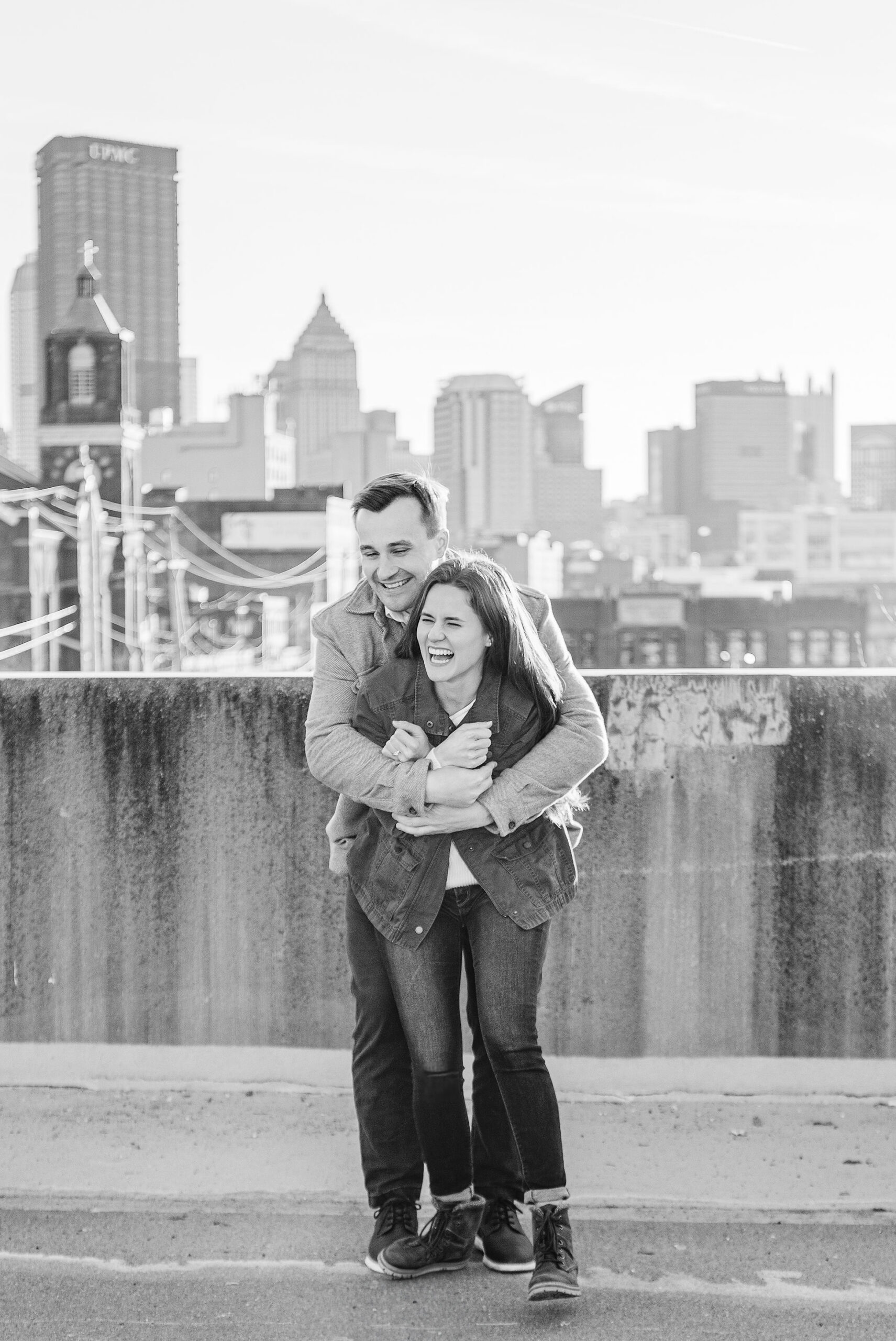 Couple laughing together during their Pittsburgh engagement session.

